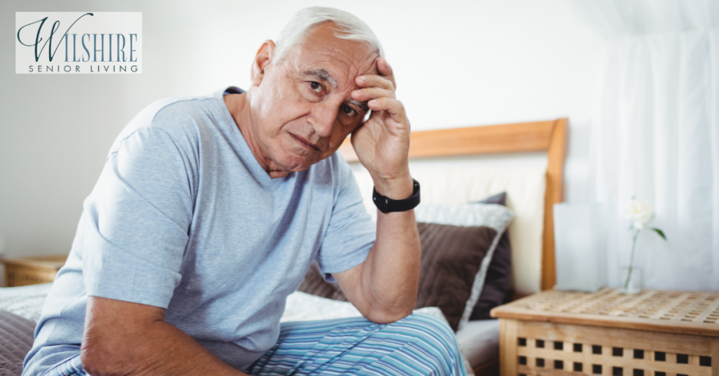 frustrated-senior-man-sitting-on-bed-1024x536