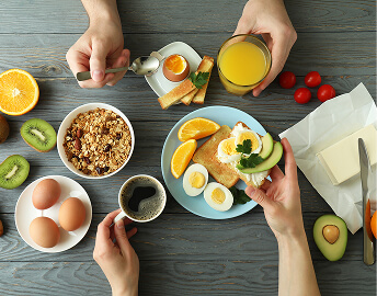 Two Elderly People Eating Breakfast at an Independent Living Facility Two Elderly People Eating Breakfast at an Independent Living Facility