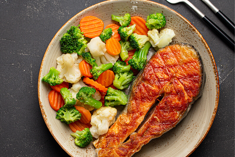 Fried Salmon with Side Vegetables Served at Memory Care Facility Fried Salmon with Side Vegetables Served at Memory Care Facility