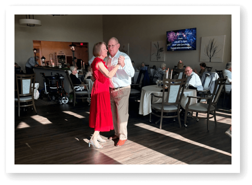 Elderly Couple Dancing During Music Event in Memory Care Facility