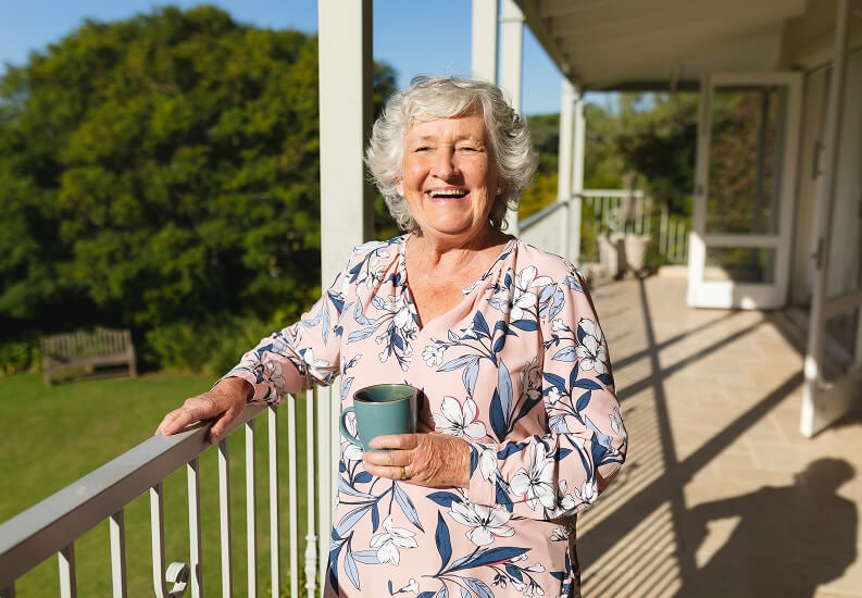 Elderly Woman Enjoying Cup of Tea Outdoor Assisted Living Facility Elderly Woman Enjoying Cup of Tea Outdoor Assisted Living Facility