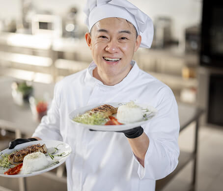 let-us-cook-for-you Elderly Man Cooking in Kitchen at Assisted Living Facility
